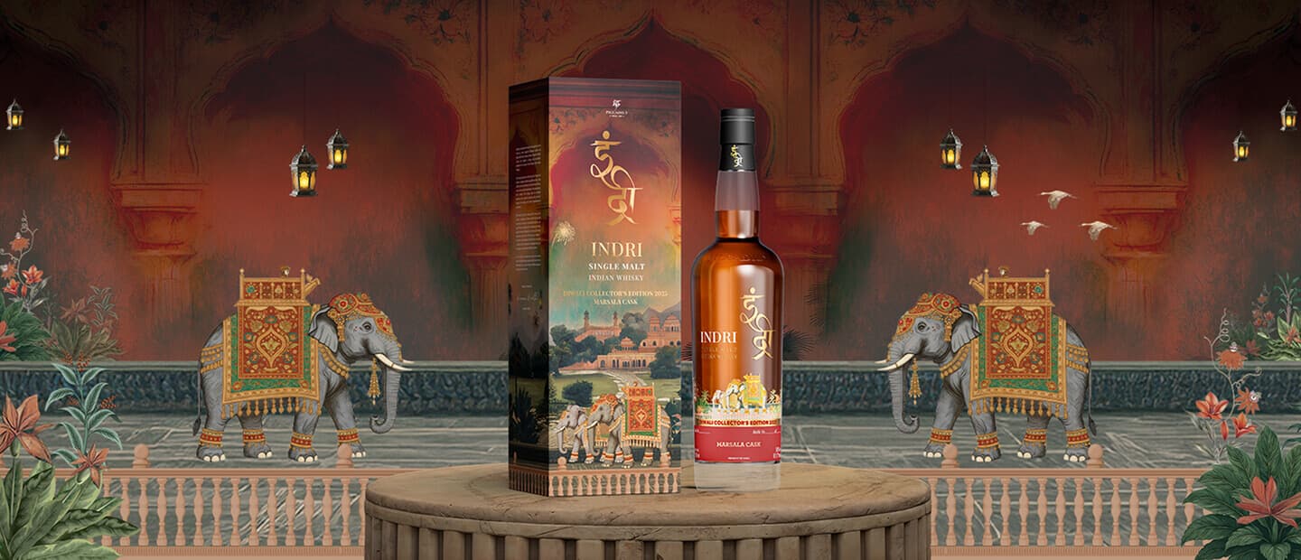 Diwali Collector’s Edition bottle and box on a palace terrace with painted elephants and lanterns